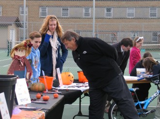 Dr. Theisen checking out the raffle items